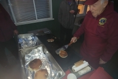 Henry flipping pancakes at Sooke Elementary